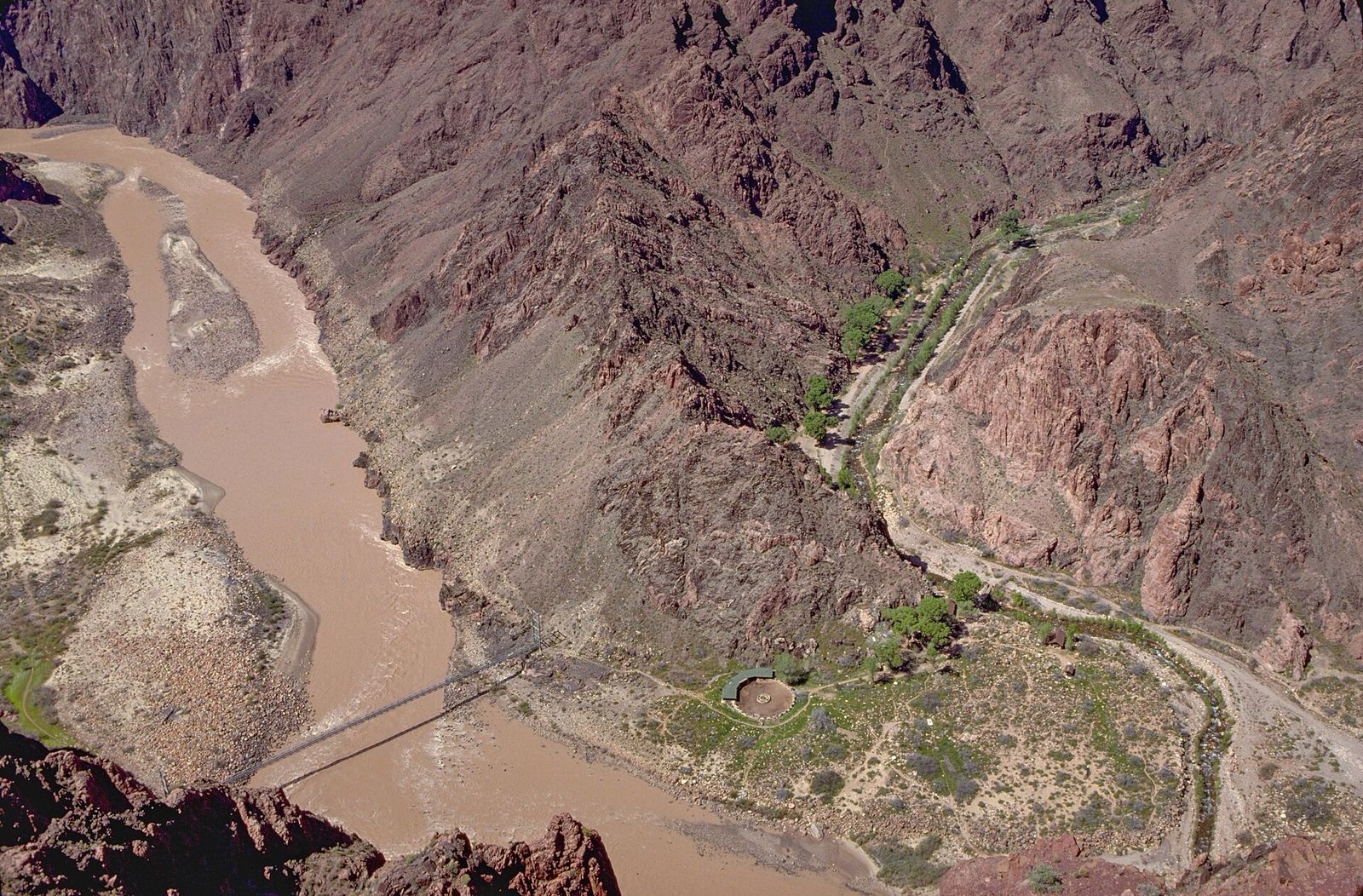 Silver Bridge and Bright Angel Campground from Above Aerial view of the Colorado River, Silver Bridge, and Bright Angel Campground deep inside Grand Canyon National Park.