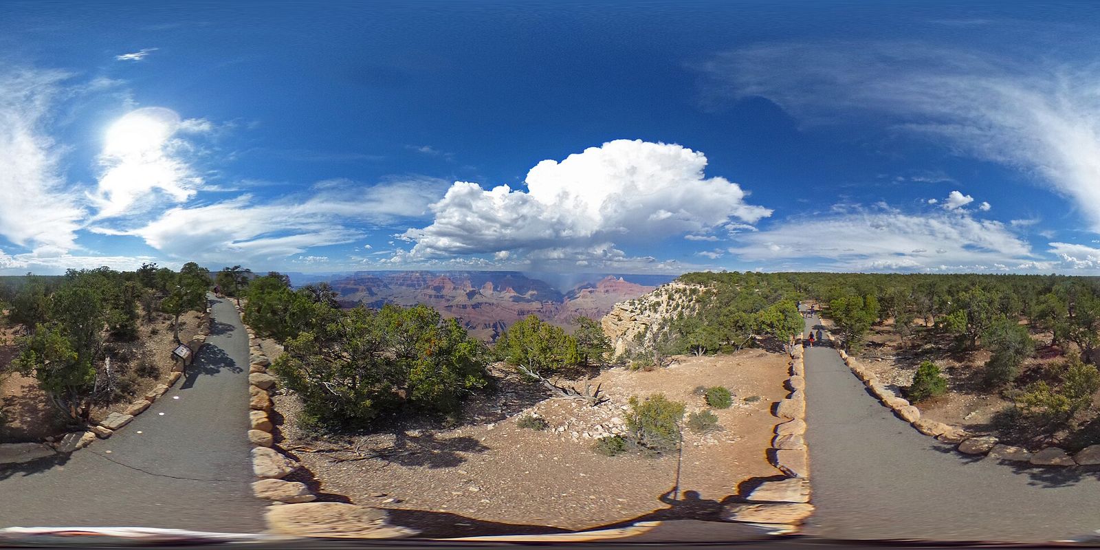 Trail of Time Panoramic View, Grand Canyon South Rim A panoramic 360-degree view along the Trail of Time paved walkway at Grand Canyon South Rim with dramatic cloudscape.