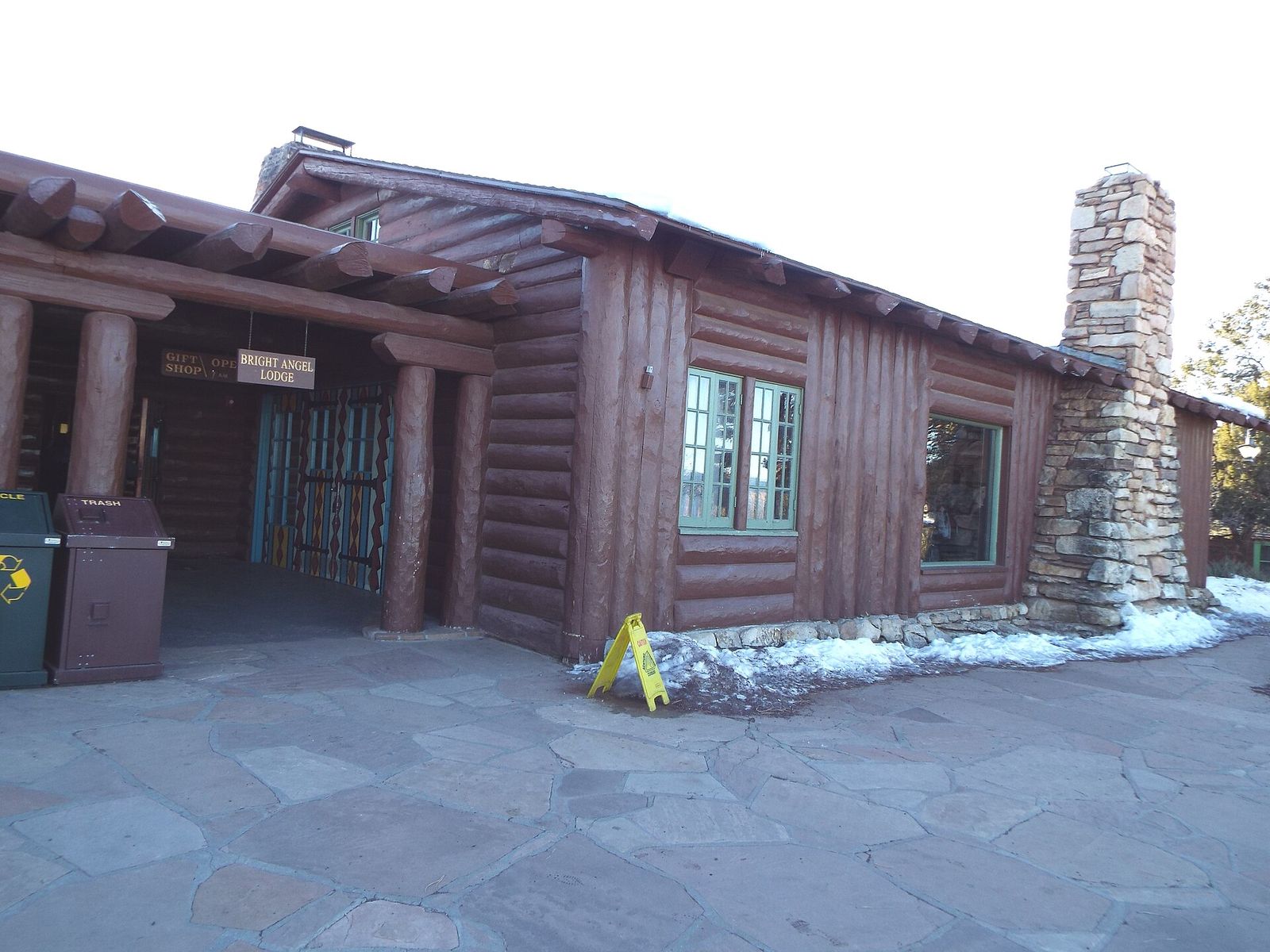 The rustic log exterior of Bright Angel Lodge on the South Rim of Grand Canyon in winter.