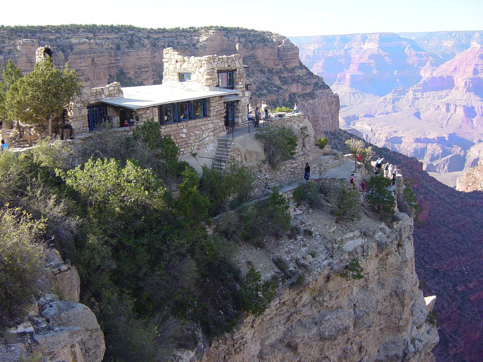 Lookout Studio on the Grand Canyon South Rim Historic Lookout Studio perched on the South Rim cliff edge overlooking the vast Grand Canyon layers below.