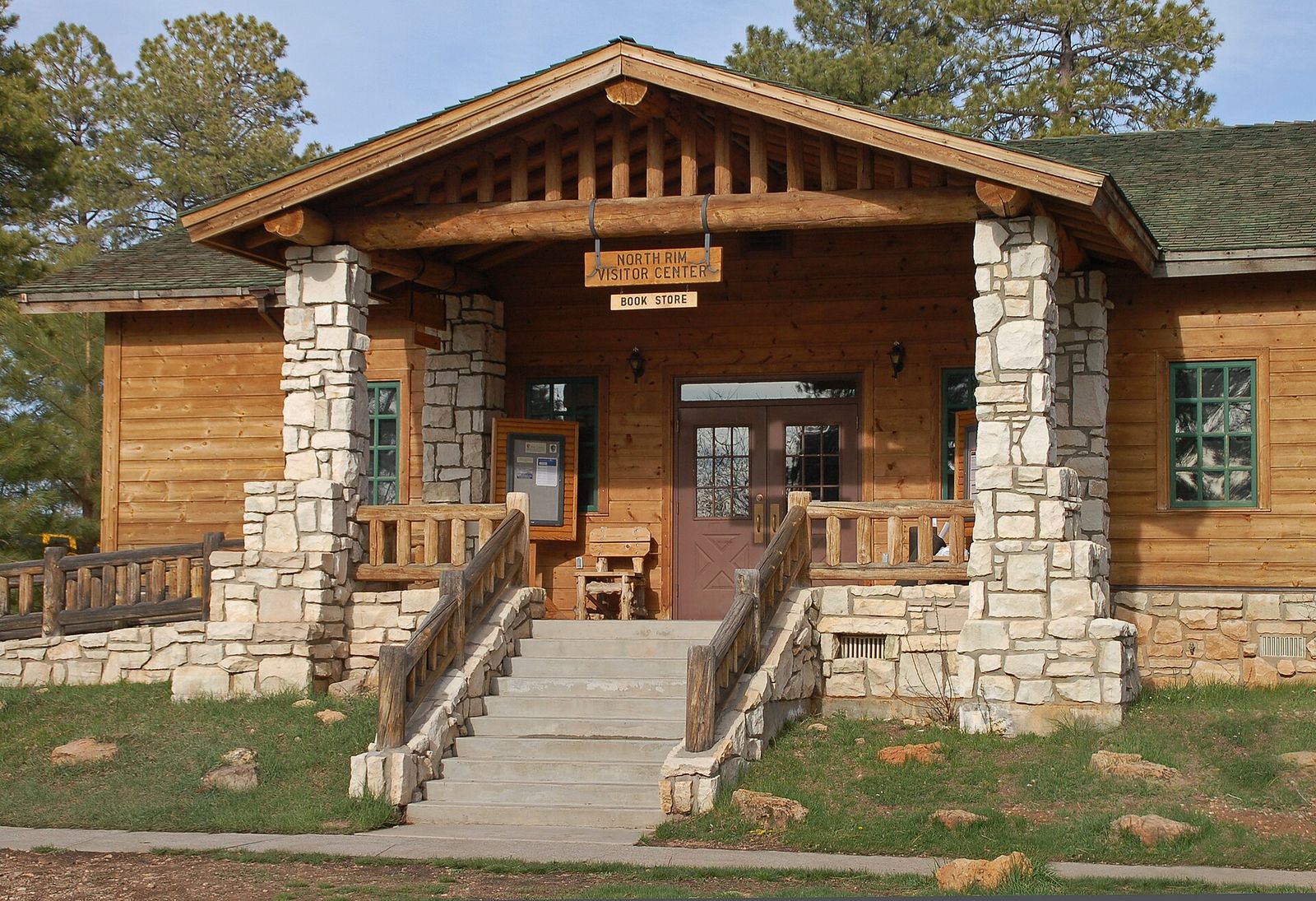 Grand Canyon North Rim Visitor Center The Grand Canyon North Rim Visitor Center and bookstore entrance, a rustic log and stone building surrounded by pines.