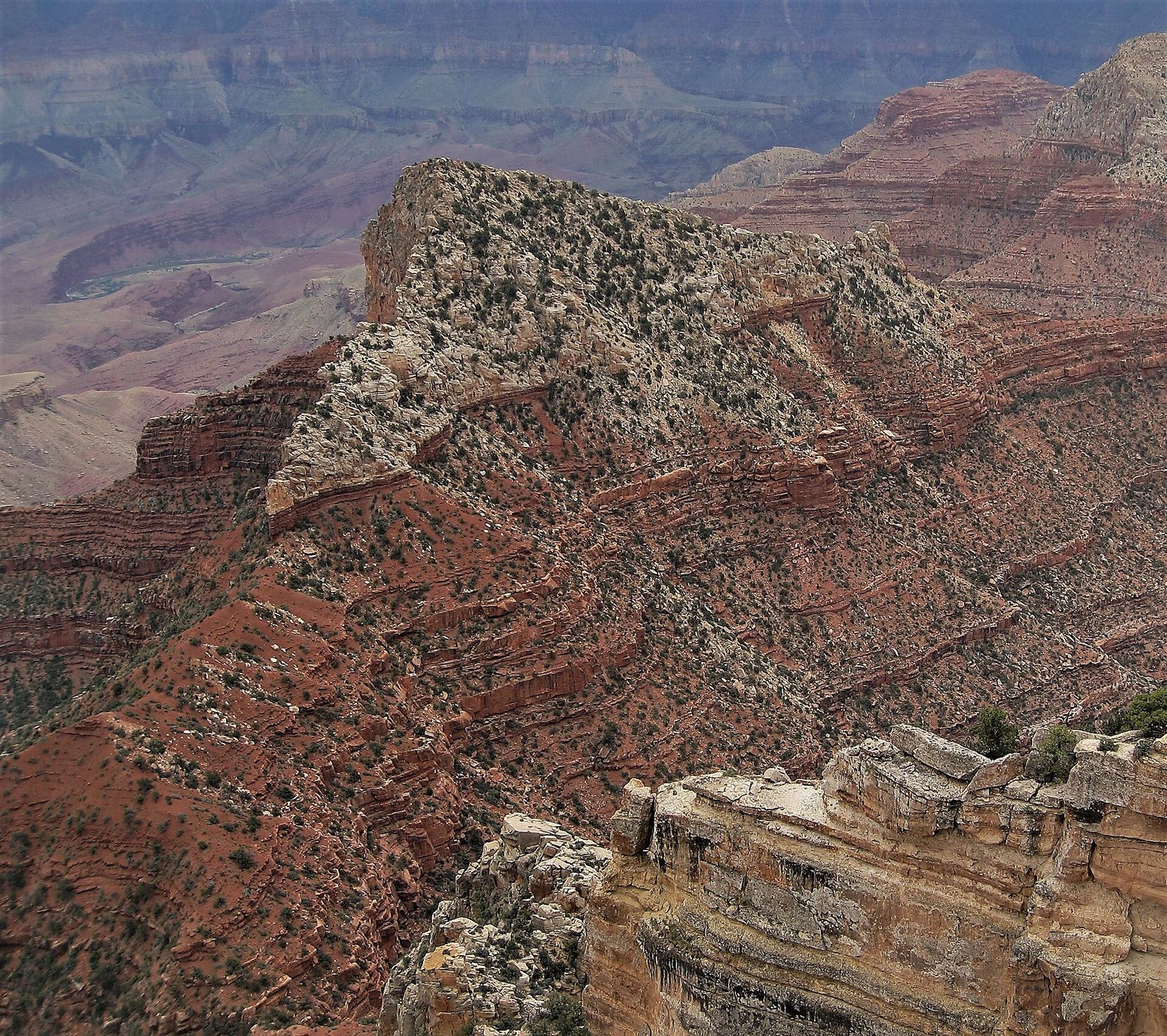 Freya Castle butte rises dramatically above layered red rock formations deep inside Grand Canyon National Park.
