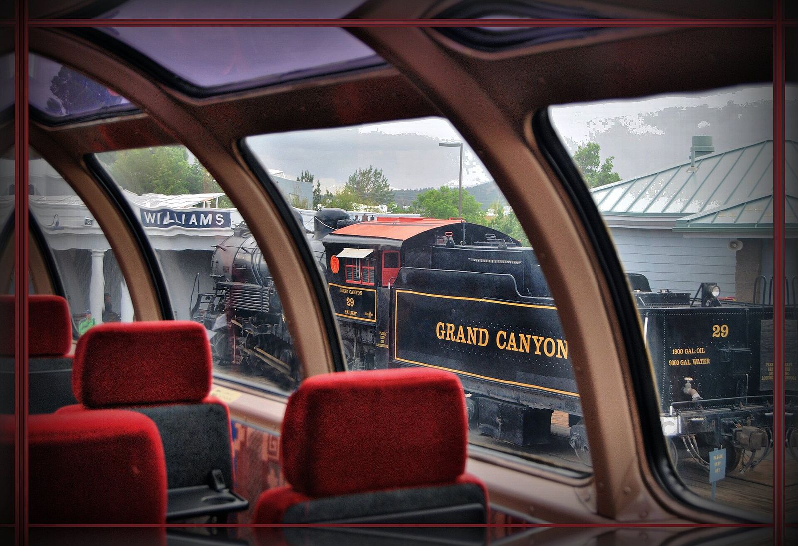 Grand Canyon Railway Locomotive at Williams Depot Grand Canyon Railway locomotive 29 seen through a dome car window at Williams Depot, Arizona.