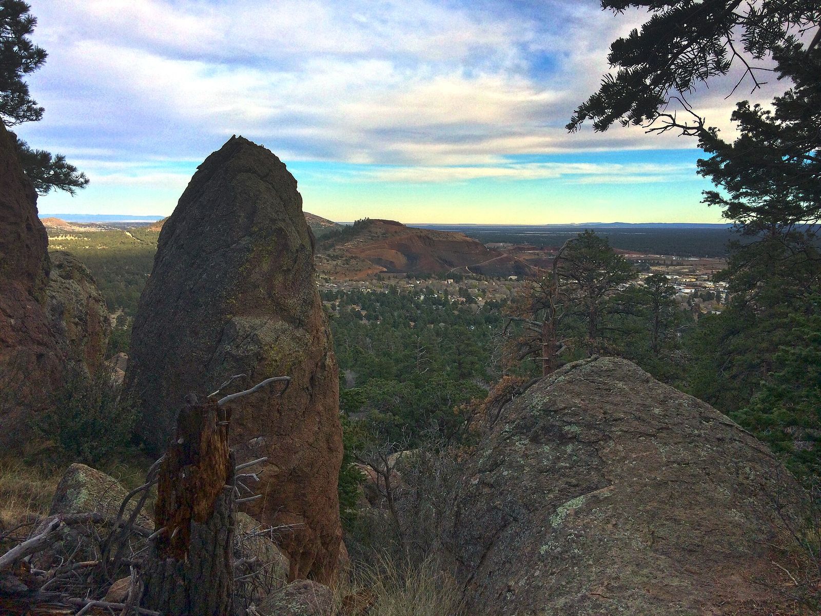 Rock Spire Overlook Near Flagstaff, Arizona A jagged rock spire frames a sweeping view of Flagstaff, Arizona, surrounded by ponderosa pine forest.
