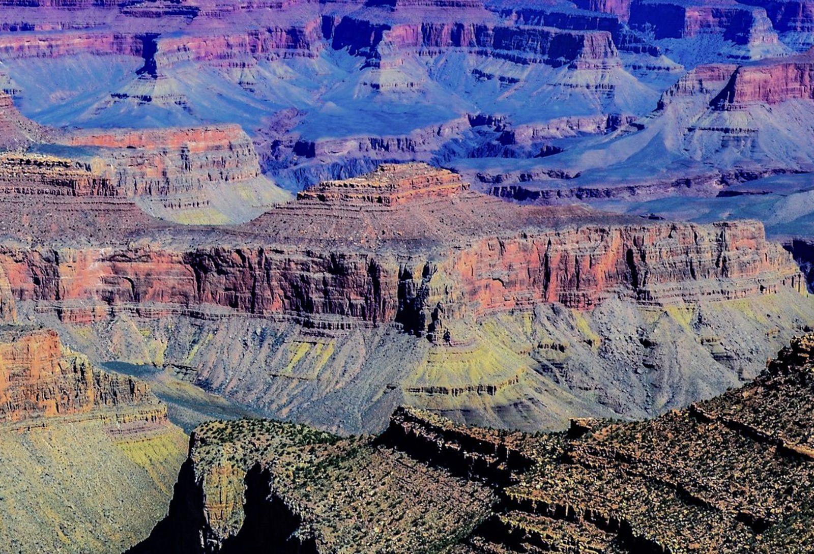 Colorful Layered Buttes Deep Inside Grand Canyon Layers of colorful red, orange, and purple rock buttes recede deep into the Grand Canyon's vast interior.