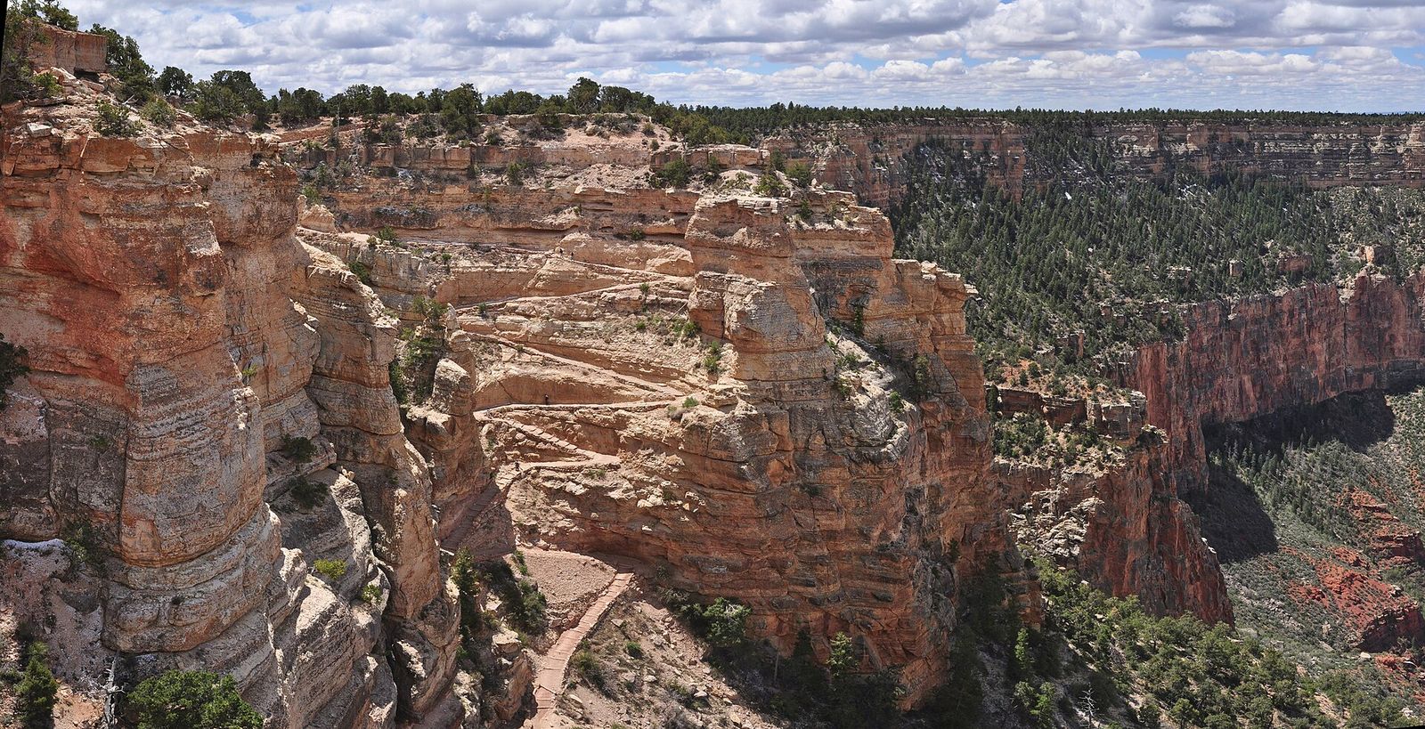 South Kaibab Trail Switchbacks at The Chimney A sweeping aerial view of South Kaibab Trail switchbacks winding past The Chimney rock formation at Grand Canyon.