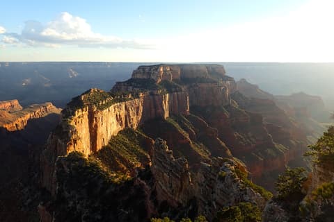 Wotans Throne butte glows in warm sunset light at the Grand Canyon North Rim, Arizona.