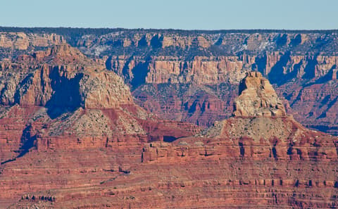 Brahma Temple and Zoroaster Temple rise as dramatic red rock buttes inside Grand Canyon National Park, Arizona.