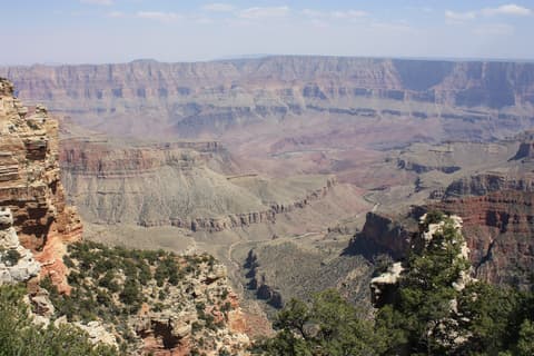 A sweeping Grand Canyon vista from Walhalla Overlook on the North Rim reveals layered canyon walls and the Colorado River below.